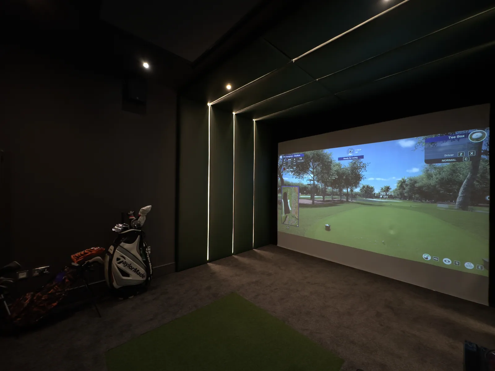 A Strikeclub home simulator room with LED strip lighting